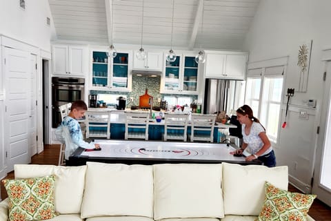 Dining table top flips to become ping pong or lifts off entirely for air hockey!!!