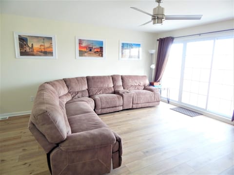 Main floor. Open concept with sectional couch with attached balcony.