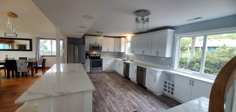 A well equipped kitchen with a range and double oven awaits you