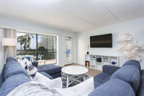 Cozy, fresh, and beachy - our living space is going to enhance your vacation with a comfy place to reconnect. From here you can enjoy a view of the ocean and resort pool, tennis court, and lawns.