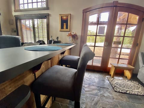 Additional dining seating at bar for two.  Table seats 6-8.