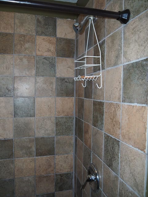 BATHROOM: Features a shower and a toilet.