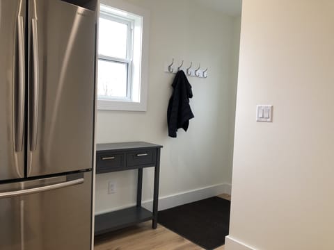 Entry area at the top of the stairs. Hang up your coat and kick off your shoes!