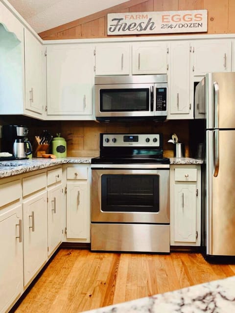 Modern appliances & granite counters finish off the open kitchen.