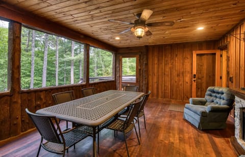 Enjoy the 3 season sunroom with a dining table for 10 or sit by the Electric Fireplace with 2 cozy recliners