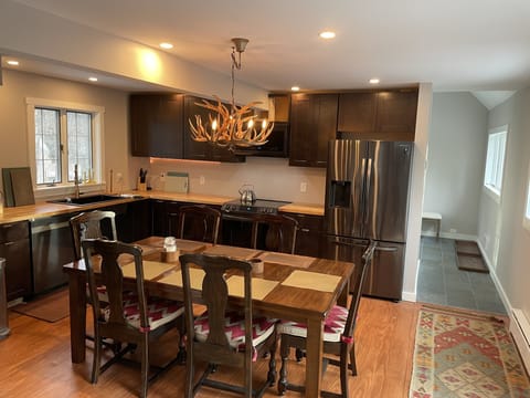 kitchen it’s dining table ( extra two chairs are downstairs)