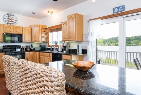 KITCHEN:  The home has a large modern kitchen with all appliances, a large kitchen island with seating, and great views of Betsie Lake!