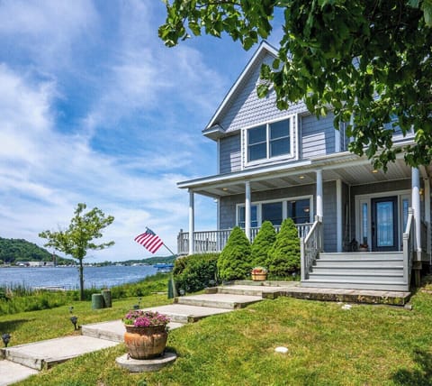 EXTERIOR:  Another view of the front of the house, with Betsie Lake in the background.
