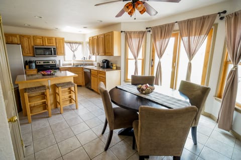 Eat-in kitchen plus card table and chairs stored in the closet to help seat all!