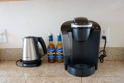 Keurig and hot pot, full coffee pot, filters and coffee grounds stocked too.