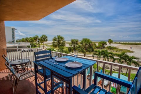 Private and spacious beachfront direct balcony with dining furniture.