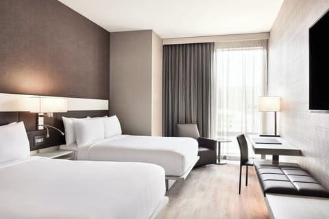 Premium bedding, down comforters, in-room safe, desk