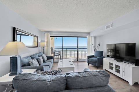 The ocean front living room is well-appointed with comfortable furnishings.