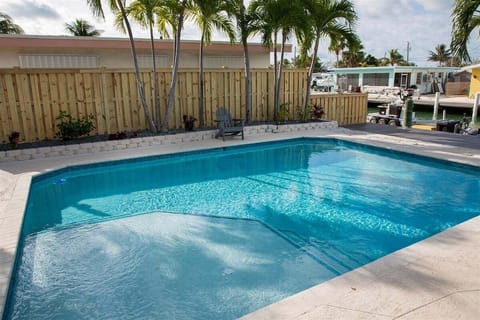 Relax in your private waterfront pool surrounded by tropical landscaping and plenty of space for sunbathing and outdoor fun.