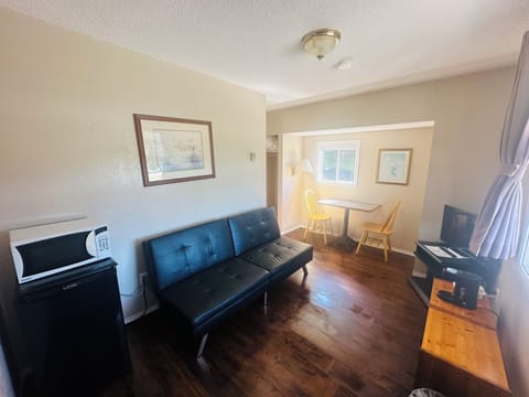 Standard Suite, 1 Double Bed | Living area | 32-inch LED TV with cable channels, TV