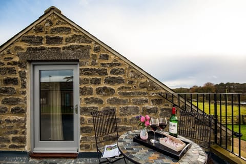 The Granary at Rothley East Shield - roof terrace with cafÃ© table and chairs to enjoy open countryside