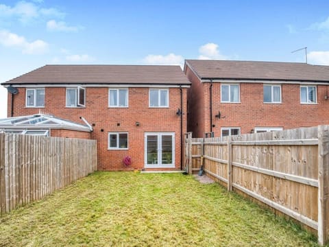 Fully fenced private garden with outdoor seating provided during spring and summer.