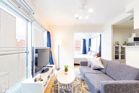 Apartment, Non Smoking | Living room | Flat-screen TV