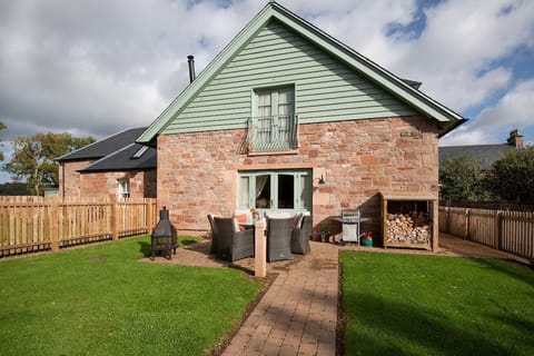 Dryburgh Steading Four - outside seating area with lawned garden