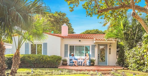 This captivating quaint beach cottage with its heated pool is just steps away from the Ocean.