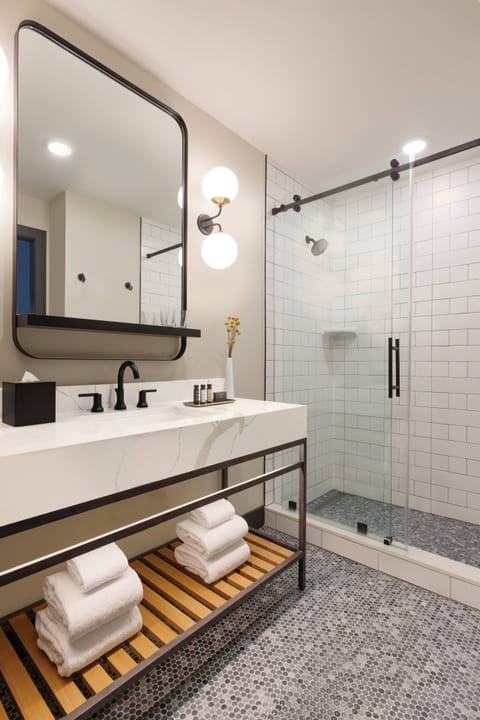 Designer toiletries, hair dryer, bathrobes, slippers