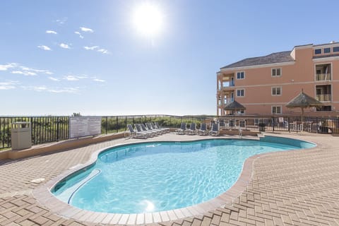Take a refreshing swim in the beachfront community pool just steps from the Gulf.