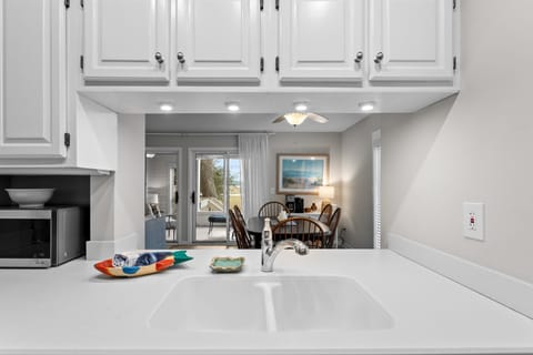 Kitchen has pass counter into the dining room