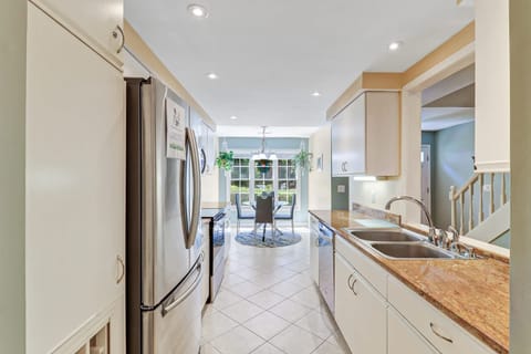 Kitchen has plenty of counter space and pantry storage for groceries