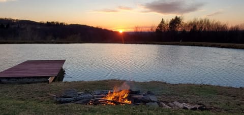 Pond and bonfire area is just 200 feet from the West Deck. deck.