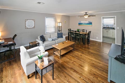 Living area with comfy seating and wood floors