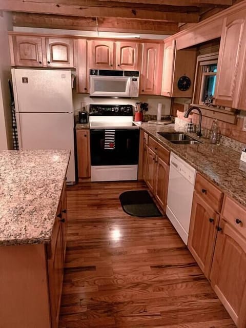 Kitchen with all new dishes/cookware.