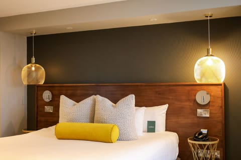 Signature Suite | In-room safe, desk, laptop workspace, iron/ironing board