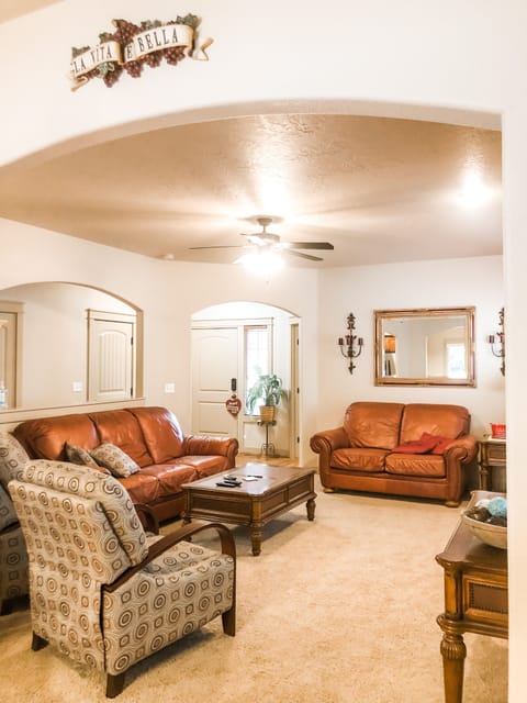 This cozy living room is comfortable to sip on hot chocolate by the fireplace. 
