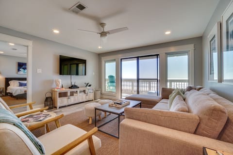 Unwind in your spacious living room with plush seating, modern entertainment, and stunning ocean views from your private balcony.
