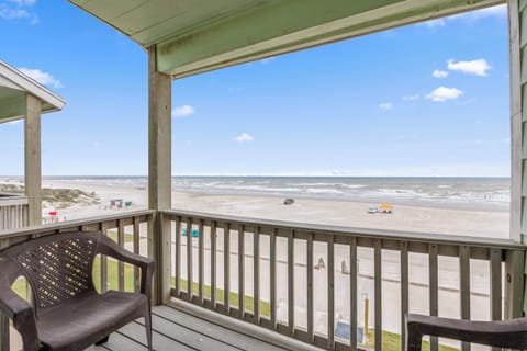 Relax on your private balcony with unobstructed ocean views, watching waves roll onto pristine sand below.