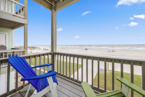 Unwind on your private living area balcony with an amazing beachfront view.