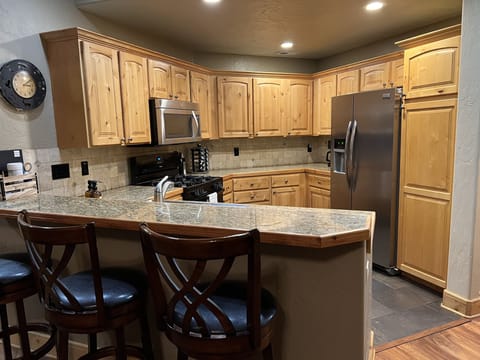 Fully equipped kitchen with Google Home for music, recipes, events & weather