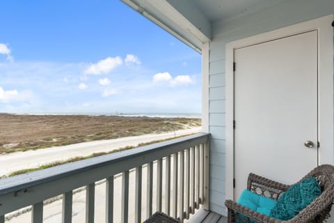Sip your morning coffee in this cozy wicker chair while gazing across endless coastal marshlands from your private covered balcony.