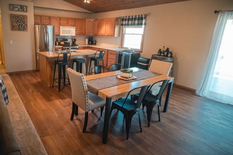Open concept dining room, kitchen, and living room. 