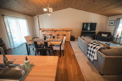 Dining room and custom bar with live edge walnut bar top. 