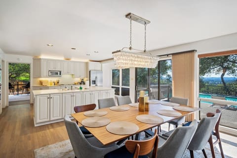 Dining table easily sits 10 people. The house has 12: small and large plates, bowls, mugs, water glasses, and silverware. 12 wine, champagne, and old fashioned glasses are also provided. The kitchen is equipped with a variety of serving dishes.