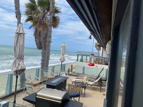 Upstairs desk - includes bbq, 6 chairs, and two lounges