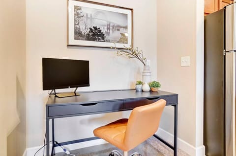 This work station makes our place perfect for anyone who works from home! It comes with the second monitor (shown) which you can hook up to your laptop with the included adapters. :)  