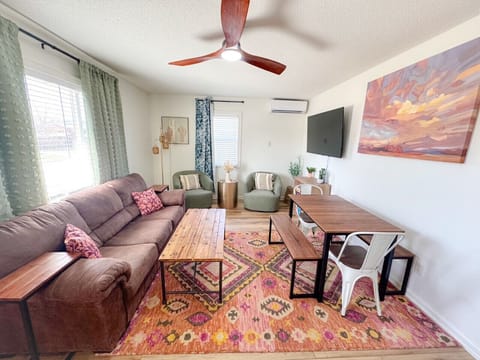 Newly remodeled unit! Living room has a sleeper sofa, plenty of seating, TV with cable provided, and lots of bright light!