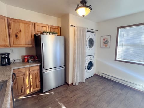 Fully equipped kitchen with new fridge, dishwasher, and laundry!