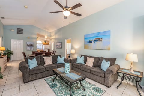 Relaxing Living Room Area with Coffee Table and Flat Screen TV