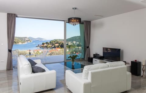 Villa (Five-Bedroom Villa with Private Pool) | Living room | Flat-screen TV