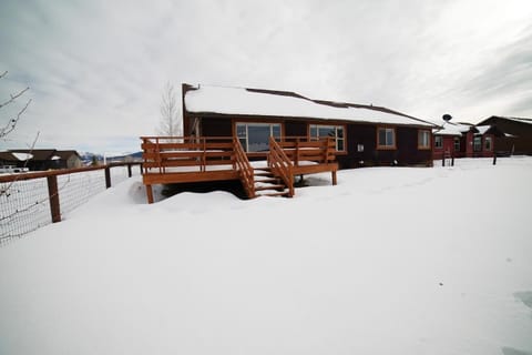 The fenced-in backyard is perfect for kids or pets, and it even has a deck!