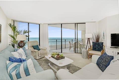 Wake up to breathtaking ocean views from your bright living room, where floor-to-ceiling windows frame endless blue horizons and your private balcony awaits.