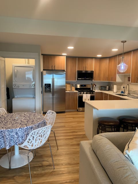 Fully equipped kitchen has 5 burner gas range, side-by-side refrig. w/icemaker